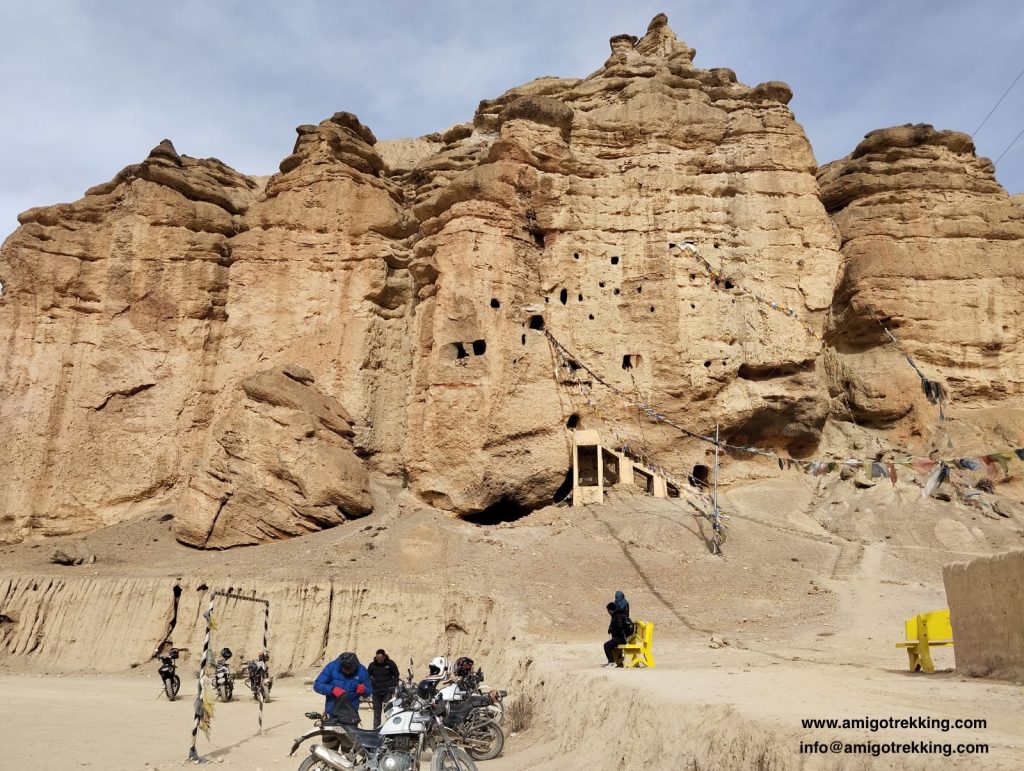Bikers on Upper Mustang Tour stopping to admire the beaty of Caves in Chhoser, Upper Mustang